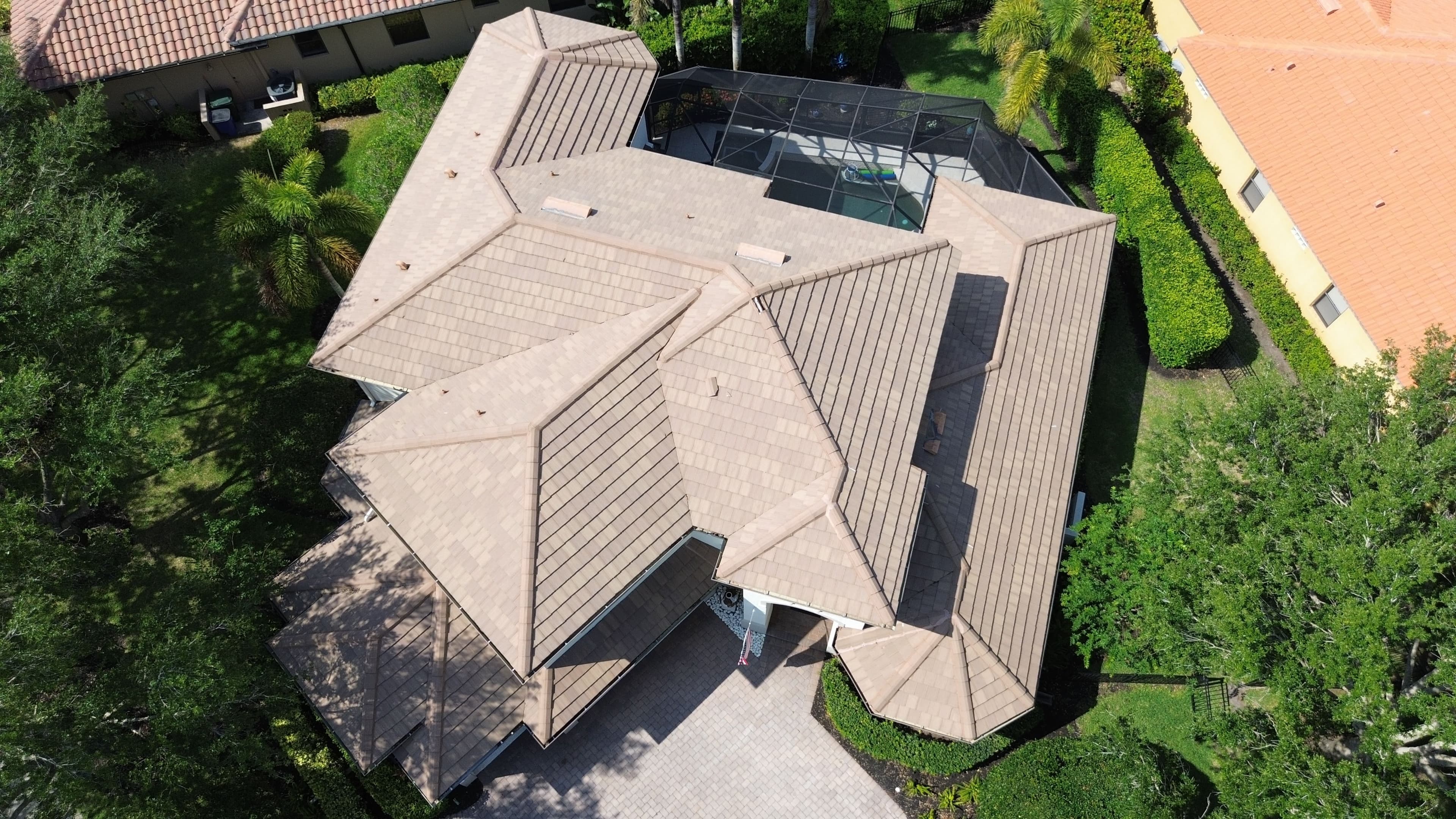 Project Cracked Clay Tiles Out, Metal Tile Roof In for This Florida Home image